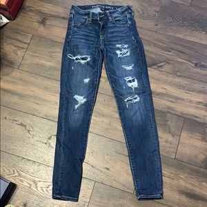 dark blue ripped jeans